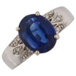 A 9ct white gold sapphire and diamond dress ring, set with oval mixed-cut sapphire and single-cut