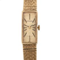 LONGINES - a lady's 9ct gold mechanical bracelet watch, circa 1973, textured gilt rectangular dial