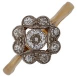An Art Deco 18ct gold diamond dress ring, openwork settings with old European-cut diamonds,