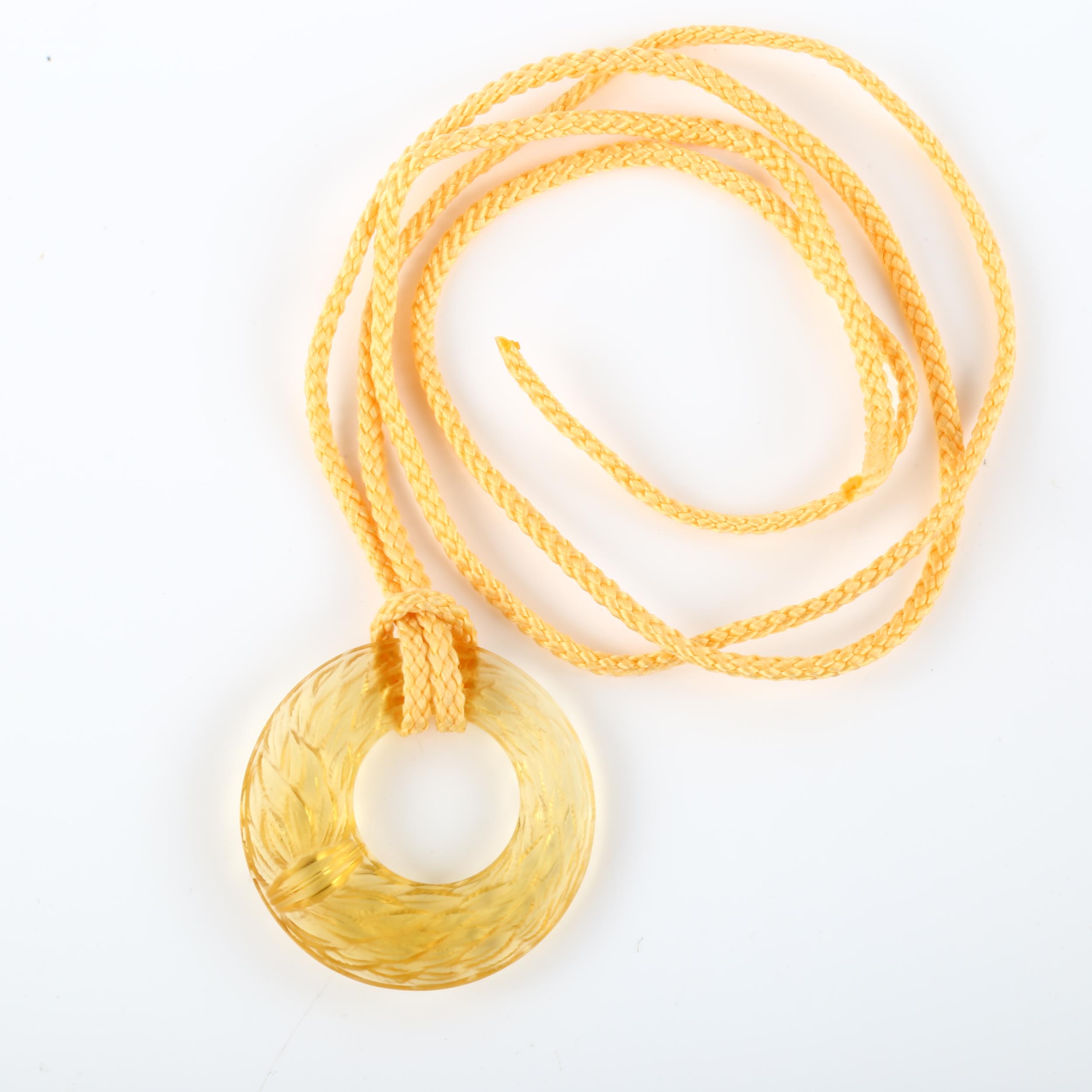 LALIQUE - an amber glass laurel wreath disc pendant, signed Lalique France, diameter 44.1mm, 14. - Image 3 of 6