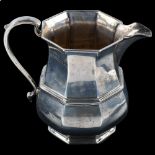 An Art Deco George V silver octagonal baluster cream jug, by Roberts & Belk Ltd, Jubilee hallmarks