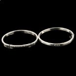2 unmarked silver cubic zirconia hinged bangles, internal circumference 17cm, 21.9g total (2) No
