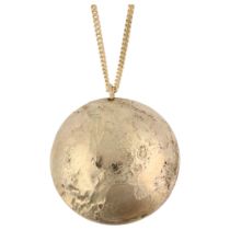 A 1970s 9ct gold moon surface pendant necklace, domed textured form, on 9ct fine curb link chain,