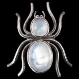 A modern moonstone figural spider brooch, unmarked silver settings, brooch length 36mm, 8g No damage