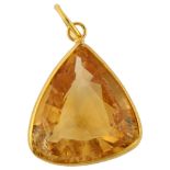 A modern citrine drop pendant, unmarked gold setting with triangular-cut citrine, pendant height