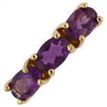 An 18ct gold three stone amethyst ring, prong set with oval mixed-cut amethyst, setting height 4.