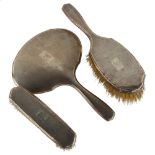 An Art Deco George V silver 3-piece dressing table set, comprising hand mirror, hair brush and