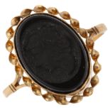 A late 20th century 9ct gold black glass cameo ring, depicting female profile in rope twist