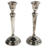 A pair of Elizabeth II silver table candlesticks, by William Adams Ltd, hallmarks Birmingham 1957,