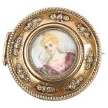 An Antique gilt-metal miniature watercolour brooch, depicting female portrait, brooch diameter 40.