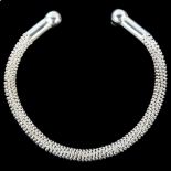 A modern handmade sterling silver rope twist torque bangle, by Claude Wilkes, hallmarks London 2017,