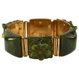 An Art Deco green Bakelite floral panel bracelet, length 17cm, 48.9g No damage or repairs, no