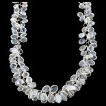 A modern sterling silver graduated moonstone cluster grape necklace, set with oval cabochon