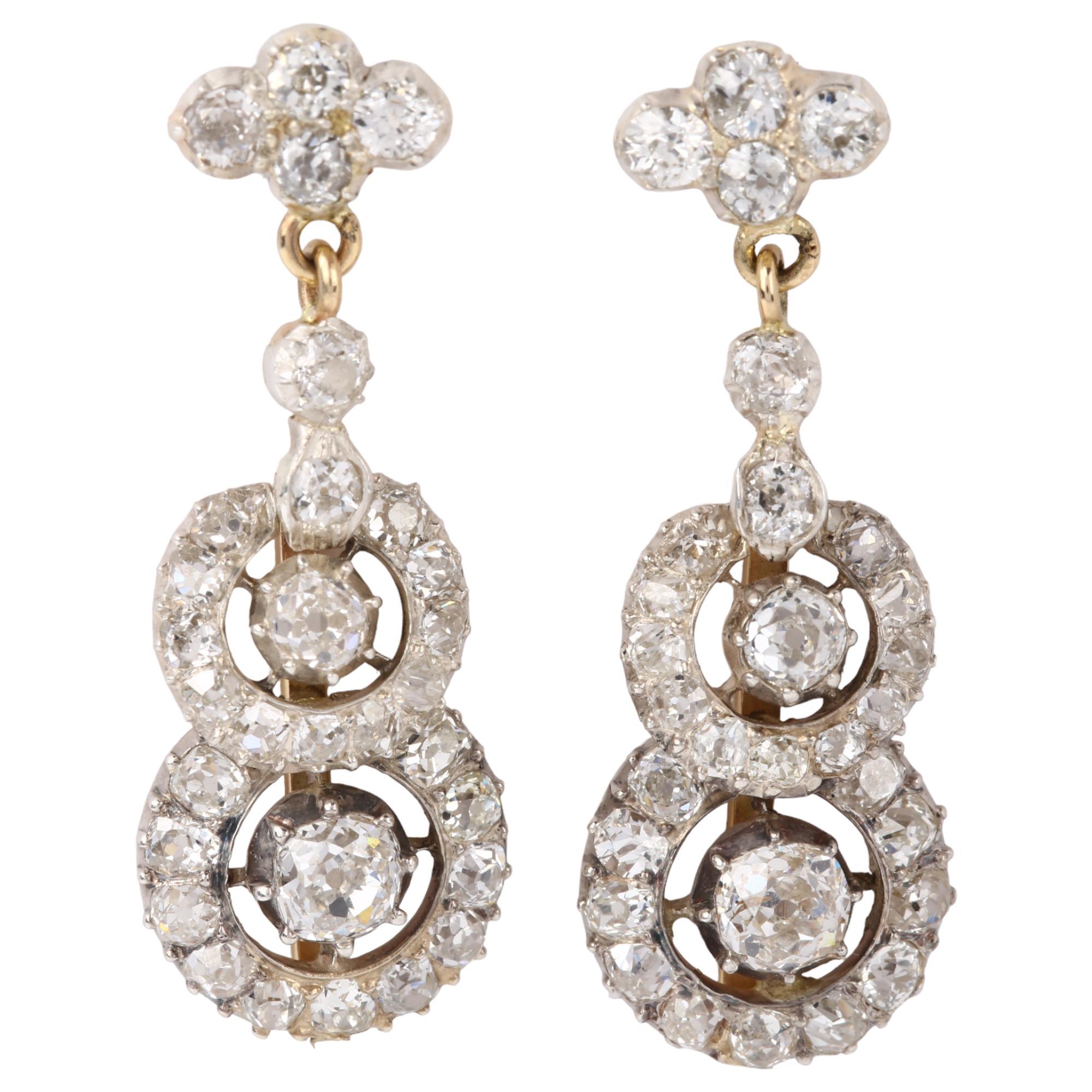 A fine pair of diamond target drop earrings, unmarked gold and silver settings with old-cut