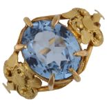 A Continental blue topaz dress ring, unmarked gold cannetille settings, setting height 14.1mm,