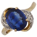 A modern 9ct gold sapphire and diamond dress ring, set with oval mixed-cut sapphire and single-cut