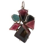 A modern gem set abstract pendant, unmarked silver settings with vari-hue tourmaline, pendant height