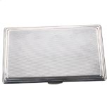 An Art Deco George VI silver cigarette case, rectangular form with stepped edge and allover engine