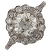 A fine Belle Epoque diamond cluster ring, unmarked white metal settings with collet set approx 1.