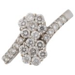 A modern 18ct white gold diamond flowerhead crossover ring, set with modern round brilliant-cut