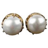 A pair of Continental unmarked gold pearl stud earrings, with screw-back fittings, pearl diameter