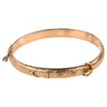 A 19th century 9ct rose gold belt buckle hinged bangle, engraved foliate decoration, hallmarks