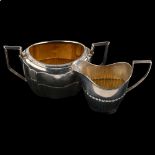 A late Victorian silver 2-handled sugar bowl, and a similar cream jug, bowl height 7cm, 4.8oz