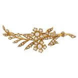 A 15ct gold split pearl floral spray brooch, early 20th century, brooch length 65.3mm, 10.7g No