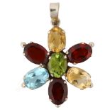 A modern gem set flowerhead pendant, unmarked silver settings with oval mixed-cut stones, pendant