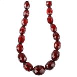 A graduated single-strand cherry amber bead necklace, with 9ct gold clasp, beads range from 17.1mm -