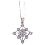 A modern 9ct white gold tanzanite spiderweb pendant necklace, on 9ct fine flat curb link chain,