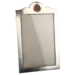 MILITARY INTEREST - a George V silver strut photo frame, shaped rectangular form with applied