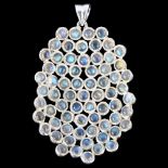 A large modern sterling silver moonstone concave honeycomb pendant, set with round cabochon