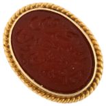 A Continental 18ct gold carnelian Arabic script ring, closed-back settings with rope twist surround,