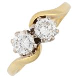 An 18ct gold two stone diamond crossover ring, claw set with modern round brilliant-cut diamonds,