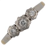 An 18ct gold three stone diamond ring, illusion set with modern round brilliant-cut diamonds,