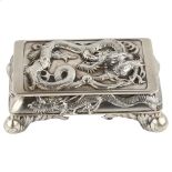 A Chinese export silver dragon double deskstand, by Wang Fat circa 1900, relief embossed dragon