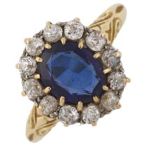 An 18ct gold synthetic sapphire and diamond cluster ring, set with oval mixed-cut sapphire and old-