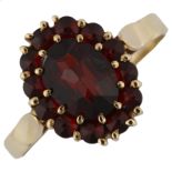 A 9ct gold garnet cluster ring, set with rose-cut garnets, setting height 12.8mm, size N, 2.7g No