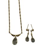 A 9ct gold blue topaz and diamond necklace and earring set, set with pear-cut topaz and modern round