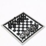 A 1960s' modernist chess set by ALCAN, France, aluminium pieces with aluminium framed mirror