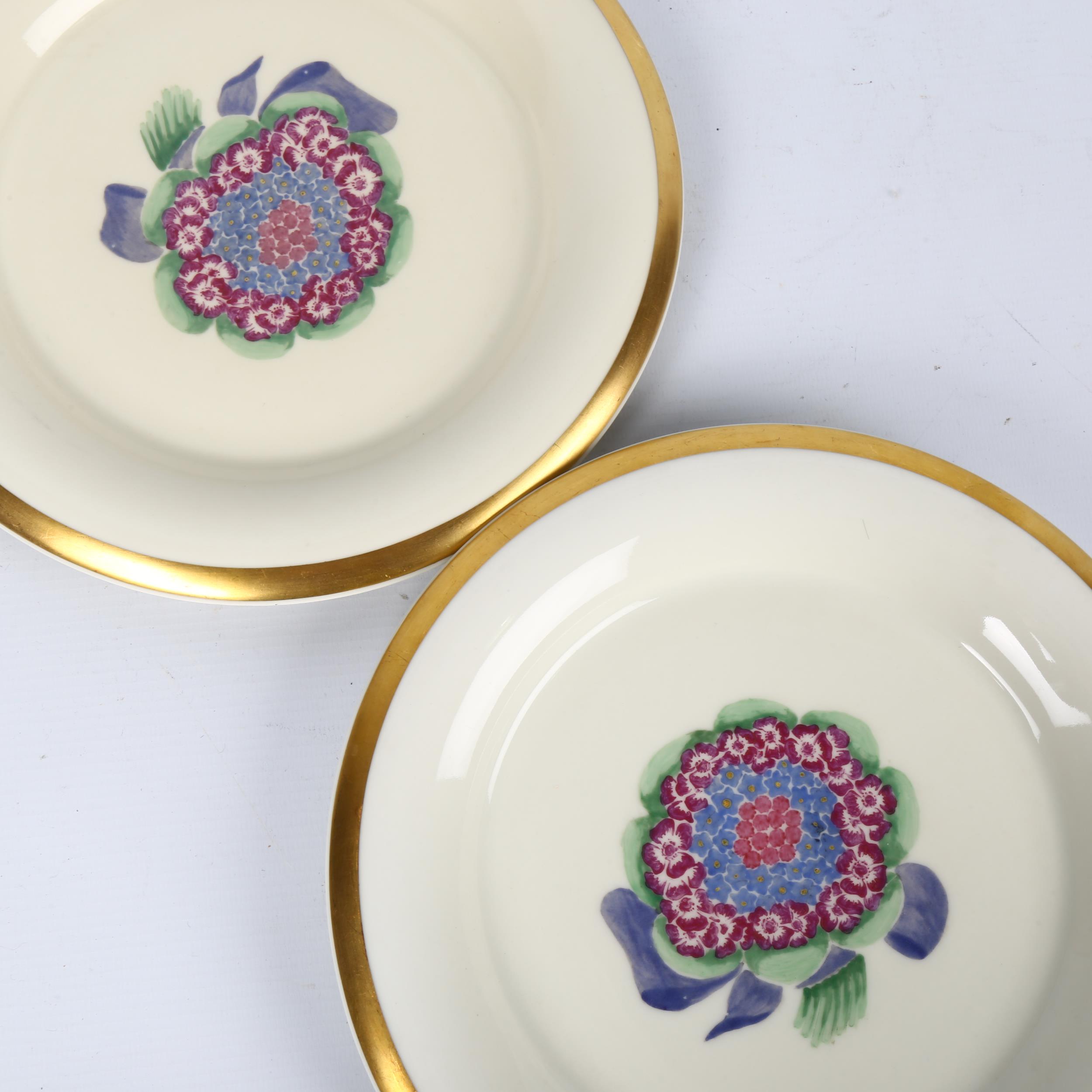 MARCEL GOUPY for ROUARD, Paris,1930s, a pair of dinner plates with gilt rim and sponged floral