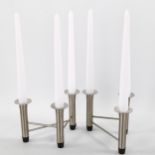 A pair of mid-century Danish style stainless steel 3 branch candleholders with sconces (includes