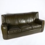 A 1940s' green leather club style 3 seat sofa, on casters length 180cm, height 82cm Structually