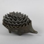 A mid-century brass stacking hedgehog, no makers mark. Wear commensurate with age and use