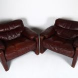 DE SEDE of Switzerland, a pair of mid-century leather armchairs, height 78cm Some wear to leather on