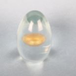 A glass egg with gold foil interior, in the style of TAPIO WIRKKALA for VENINI, unsigned, height 9cm