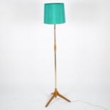 ORSJO Lighting, a 1950s' oak and brass standard lamp, with adjustable top and original shade, height