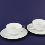 CHRISTIAN COUTY for Raynaud & Co, Limoges, a pair of porcelain tea cups and saucers, in original box