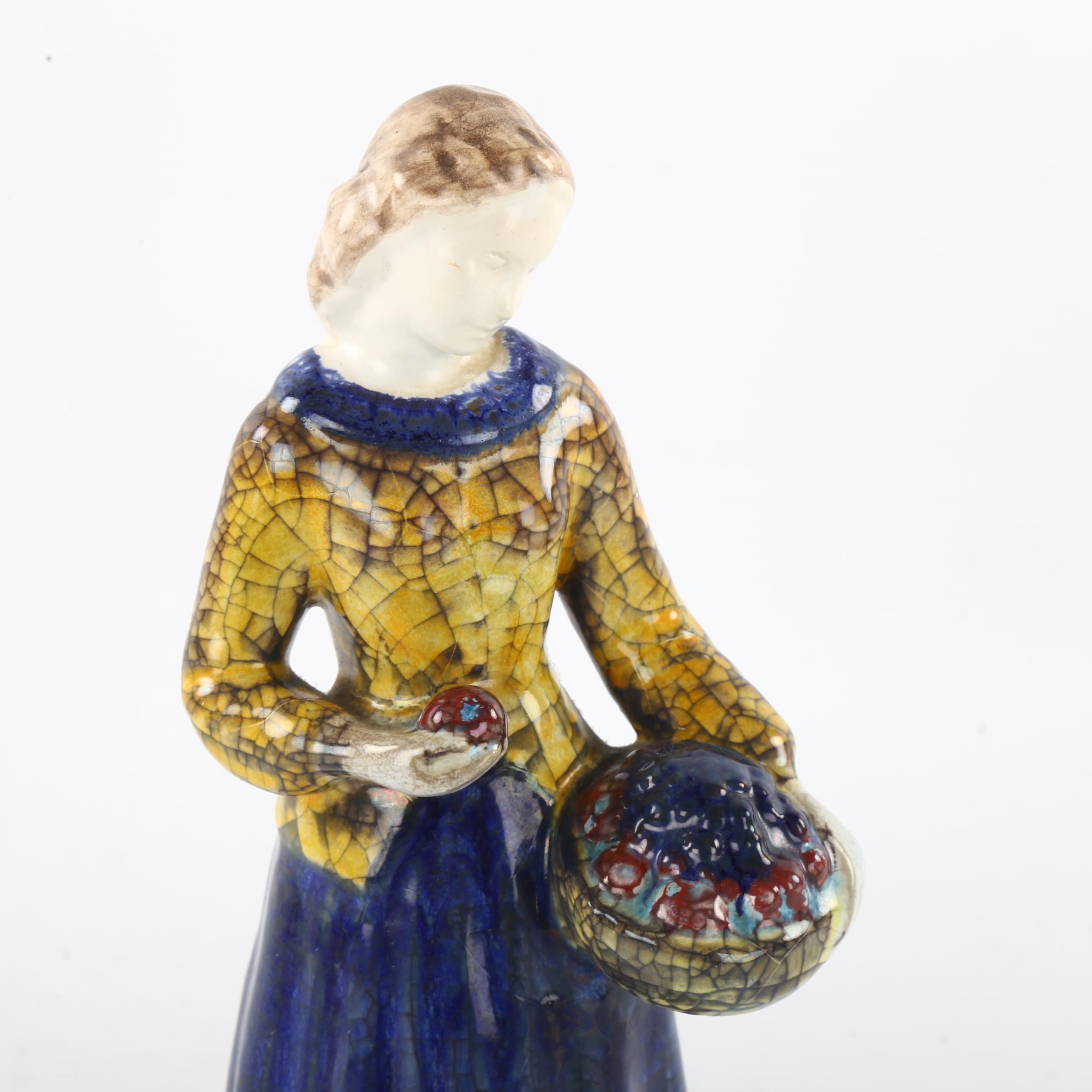 MARIANNE STARCK for Michael Andersen, a Danish pottery figurine of a woman holding a basket of - Image 3 of 4